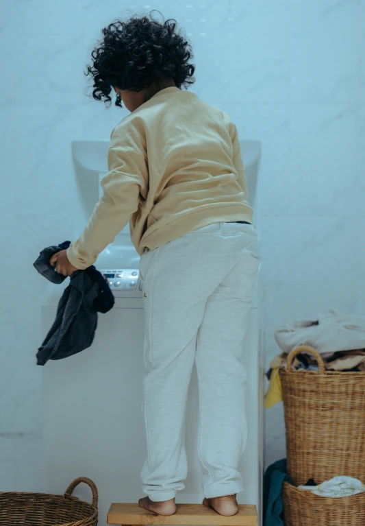 a woman standing on a stool in front of a sink, messy clothes, profile image, maintenance, unbeatable quality