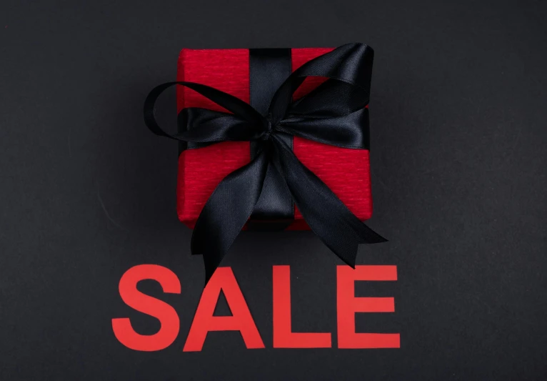 a red gift box with a black ribbon on a black background with the word sale, by Emma Andijewska, pexels contest winner, hurufiyya, square, advert, ladies, 8 h