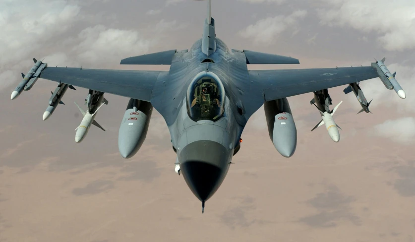 a fighter jet flying through a cloudy sky, pexels contest winner, photorealism, looking up at the camera, f16, head down, taken in the late 2010s