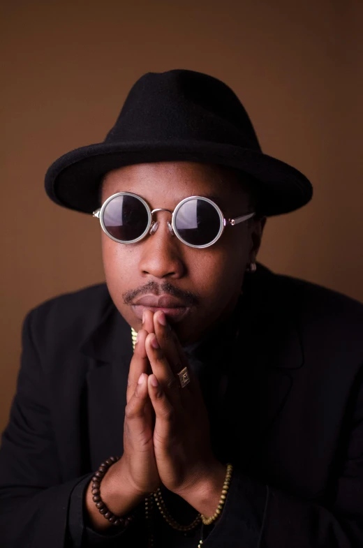 a close up of a person wearing a hat and sunglasses, an album cover, inspired by Zhu Da, unsplash, african jesse pinkman portrait, doing an elegant pose, portrait image, confident pose