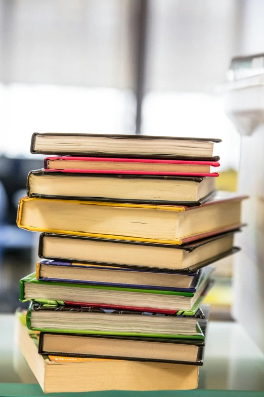 a stack of books sitting on top of a table, thumbnail, abcdefghijklmnopqrstuvwxyz, multiple stories, full-color