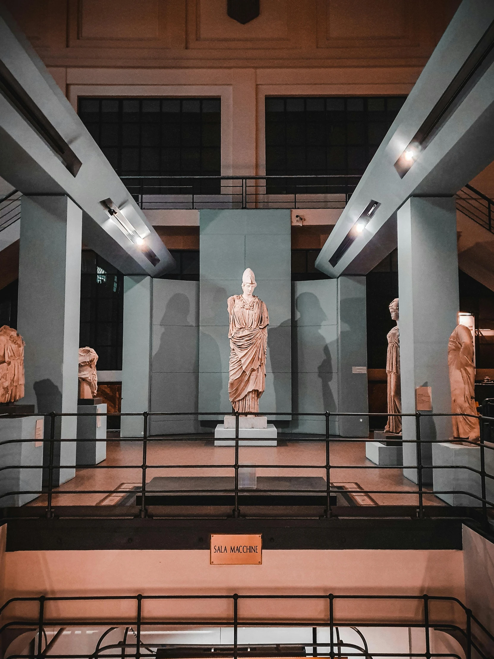 a group of statues on display in a museum, during the night, at ancinet agora of athens, posing elegantly, modern aesthetic