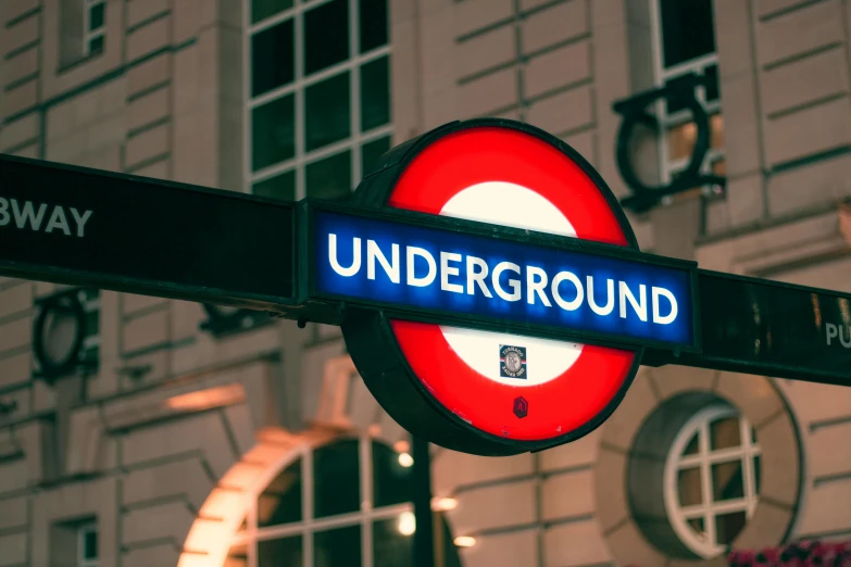 a close up of a street sign with a building in the background, unsplash, underground comix, train in a tunnel, 🚿🗝📝, round-cropped, profile image