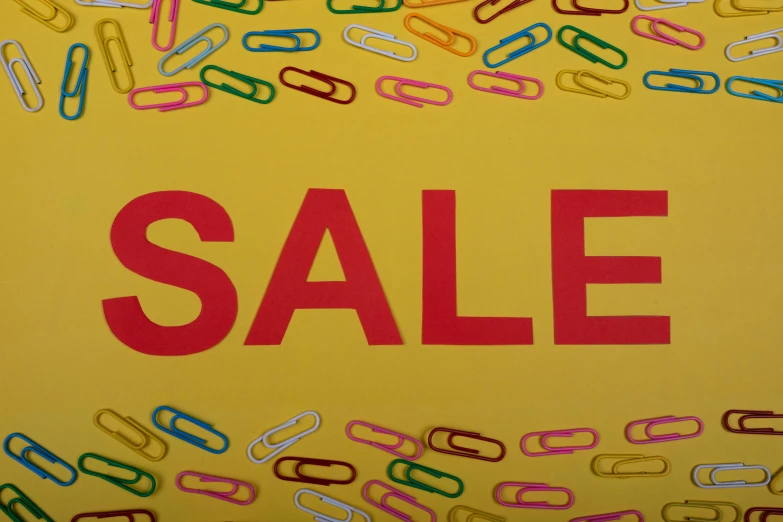 a sale sign surrounded by lots of paper clips, pixabay, pop art, red+yellow colours, thumbnail, low quality photo, neoprene