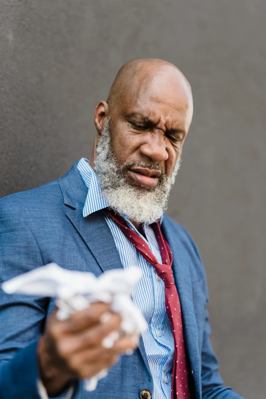 a close up of a person wearing a suit and tie, an album cover, by Samuel Washington Weis, pexels contest winner, auto-destructive art, white beard, coughing, wearing a towel, wrinkles and muscle tissues