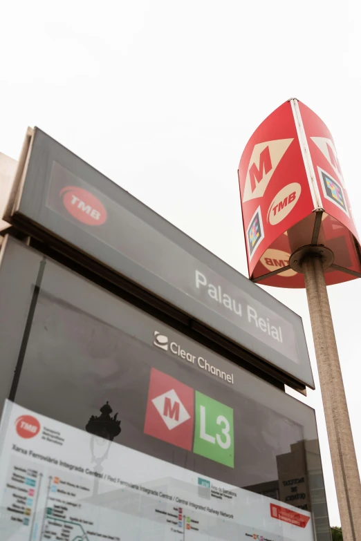 a close up of a street sign on a pole, an album cover, inspired by Raúl Martínez, regionalism, inside a gas station, tram, palme d'or winner, 3 meters