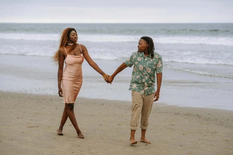 a man and woman walking on a beach holding hands, by Carey Morris, pexels, renaissance, with brown skin, lesbians, attractive girl, sza