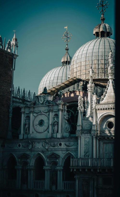 a large building with a clock on top of it, inspired by Canaletto, pexels contest winner, baroque, with great domes and arches, vista view, moody details, venice