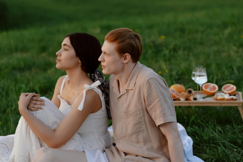 a man and woman sitting on a blanket in a field, pexels, renaissance, scene from a dinner party, anastasia ovchinnikova, brunette boy and redhead boy, ( ( theatrical ) )