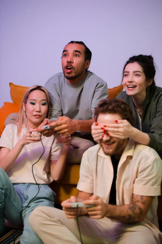 a group of people sitting on top of a couch, a picture, the video game, hands on face, trending in artsation, high-quality photo