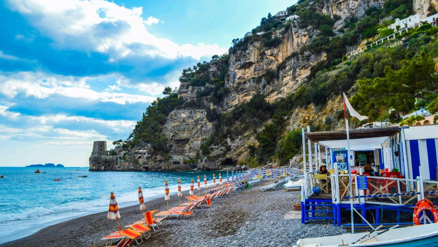 a boat sitting on top of a beach next to a cliff, vouge italy, square, fan favorite, uploaded