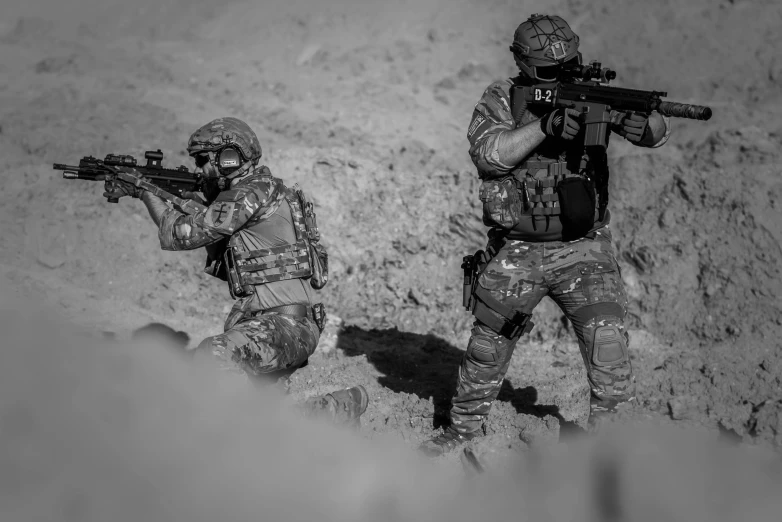 a couple of soldiers standing next to each other, pexels contest winner, battle action shot, background image, bw, battle of helmand moebius