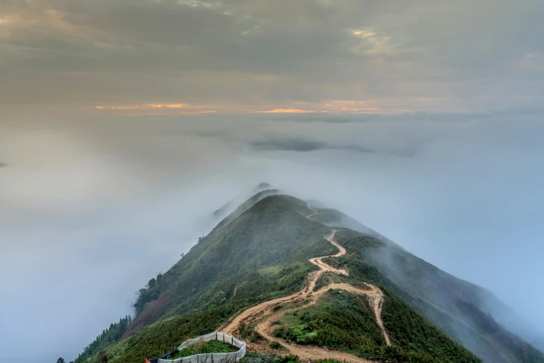 a group of people standing on top of a mountain, by Li Zai, unsplash contest winner, romanticism, large path, like jiufen, 2 5 6 x 2 5 6 pixels, covered in clouds