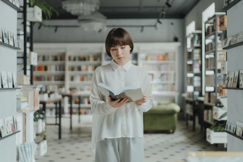 a woman standing in a library holding a book, pexels contest winner, wearing white shirt, avatar image, ad image, modern casual clothing