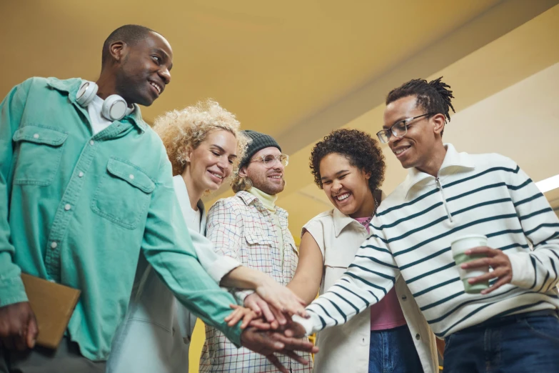 a group of people holding hands in a circle, profile image, thumbnail, diverse, casually dressed