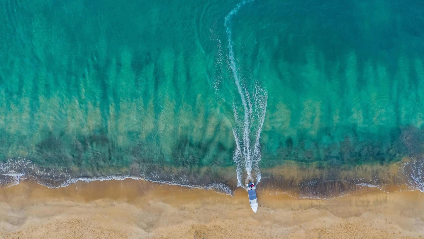 an aerial view of a boat in the ocean, pexels contest winner, standing on surfboards, australian beach, thumbnail, take off