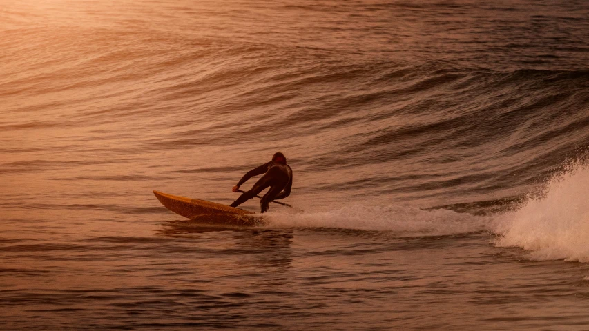 a man riding a wave on top of a surfboard, by Neil Boyle, pexels contest winner, figuration libre, warm glow coming the ground, brown, early morning, postprocessed