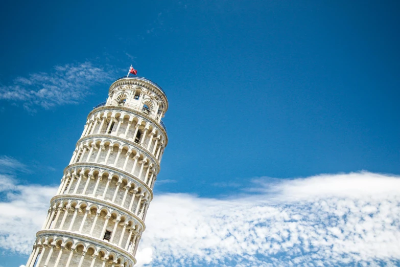 the leaning tower of pisa against a blue sky, pexels contest winner, square, vivid)