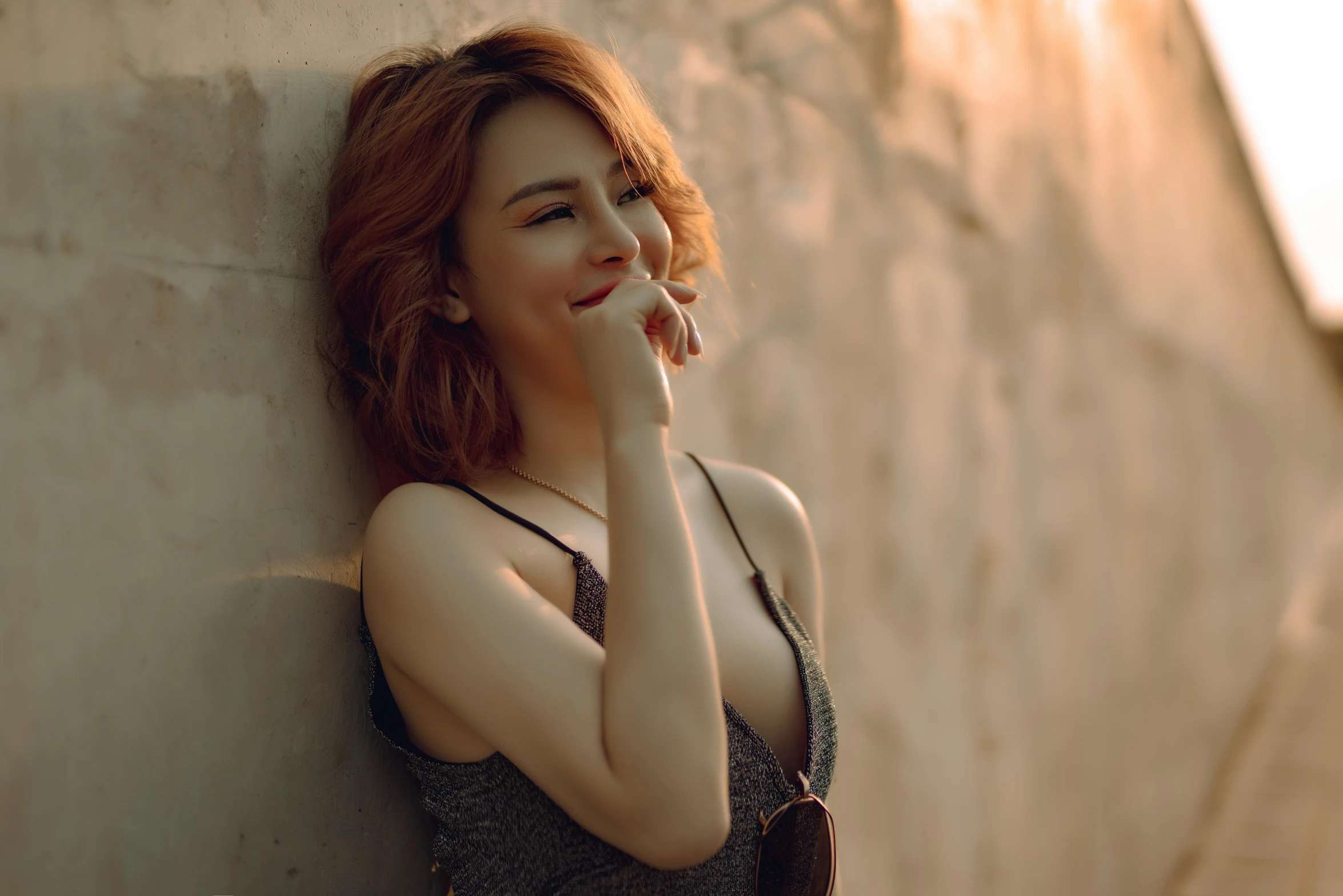 a woman leaning against a wall talking on a cell phone, a picture, inspired by Elsa Bleda, trending on pexels, happening, wearing bra, smiling :: attractive, brown-red-hair pretty face, pokimane