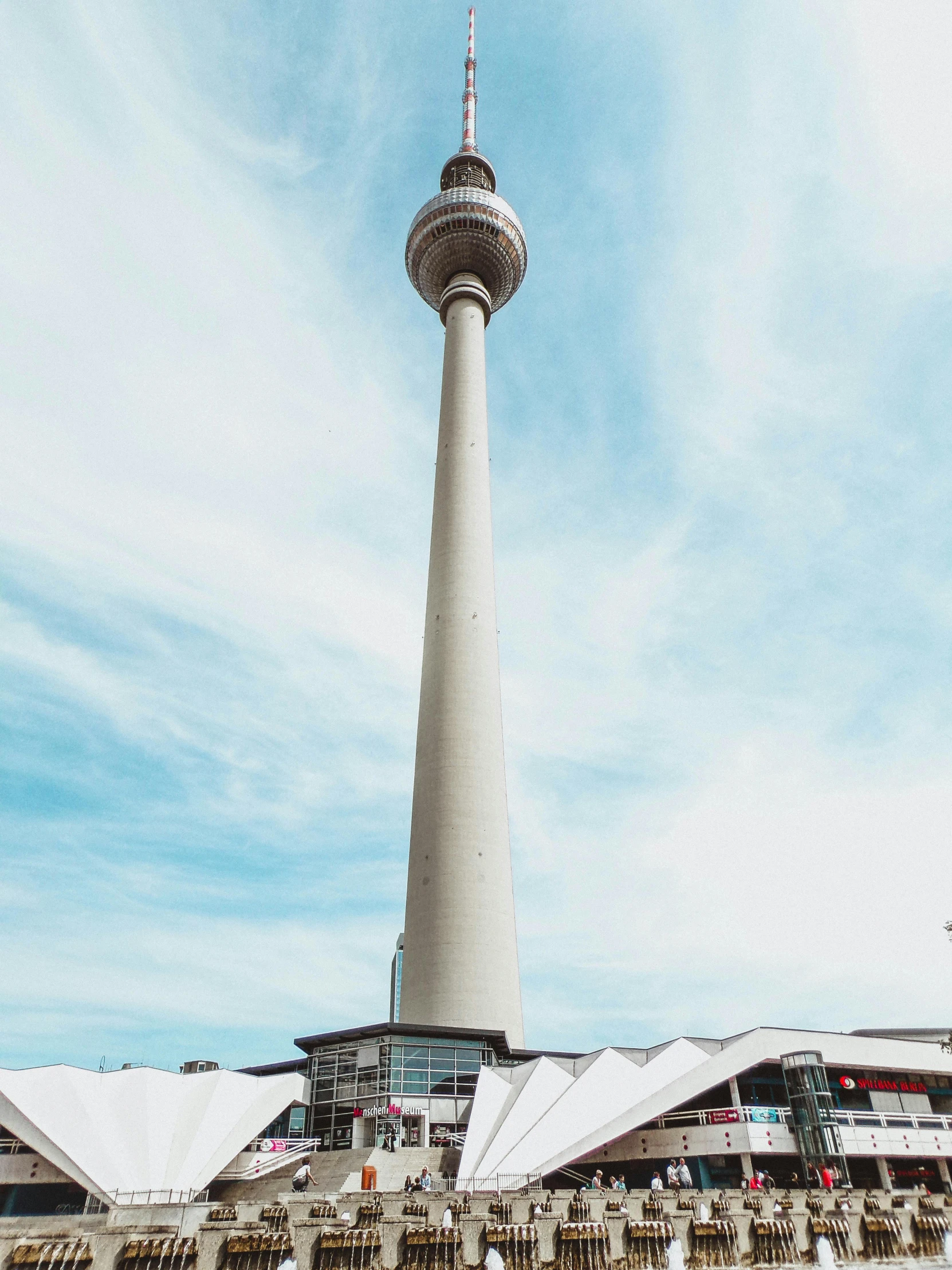 a very tall tower sitting in the middle of a city, pexels contest winner, berlin secession, 🚿🗝📝, very long neck, 🤠 using a 🖥, exterior view