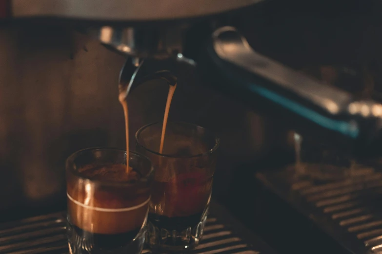 two glasses filled with liquid sitting on top of a counter, unsplash, ancient coffee machine, avatar image, no cropping, early evening