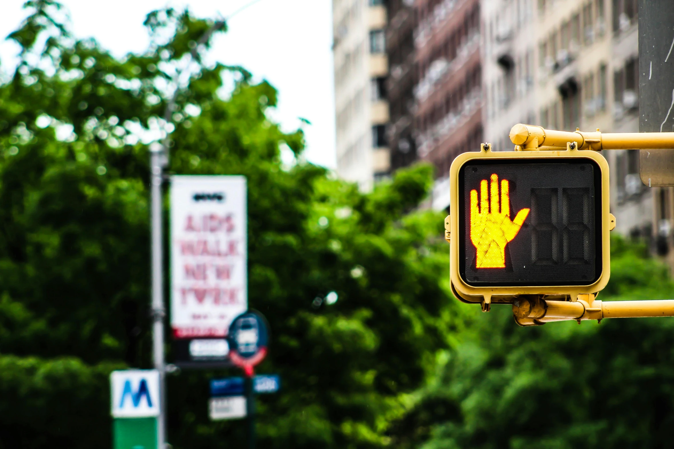 a close up of a street sign with trees in the background, a cartoon, by Julia Pishtar, unsplash, red and yellow light, hand controlling, in the middle of new york, 🚿🗝📝