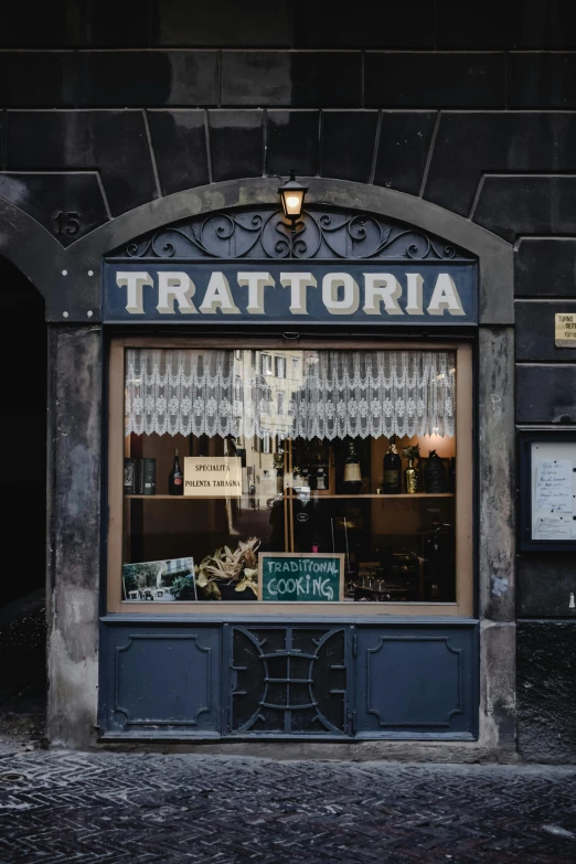 a store front with a sign that says trattora, by Carlo Martini, trending on unsplash, square, historically accurate, alcohol, 🚿🗝📝