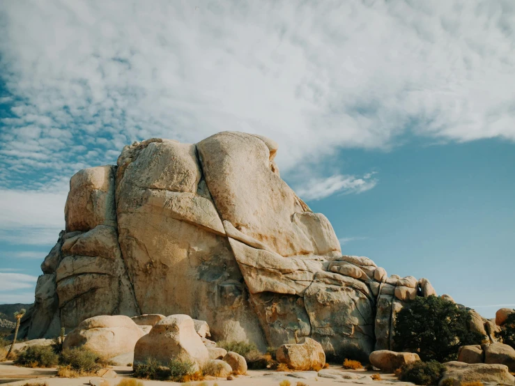 a large rock in the middle of a desert, a marble sculpture, by Ryan Pancoast, unsplash contest winner, southern california, large overhangs, granite, youtube thumbnail