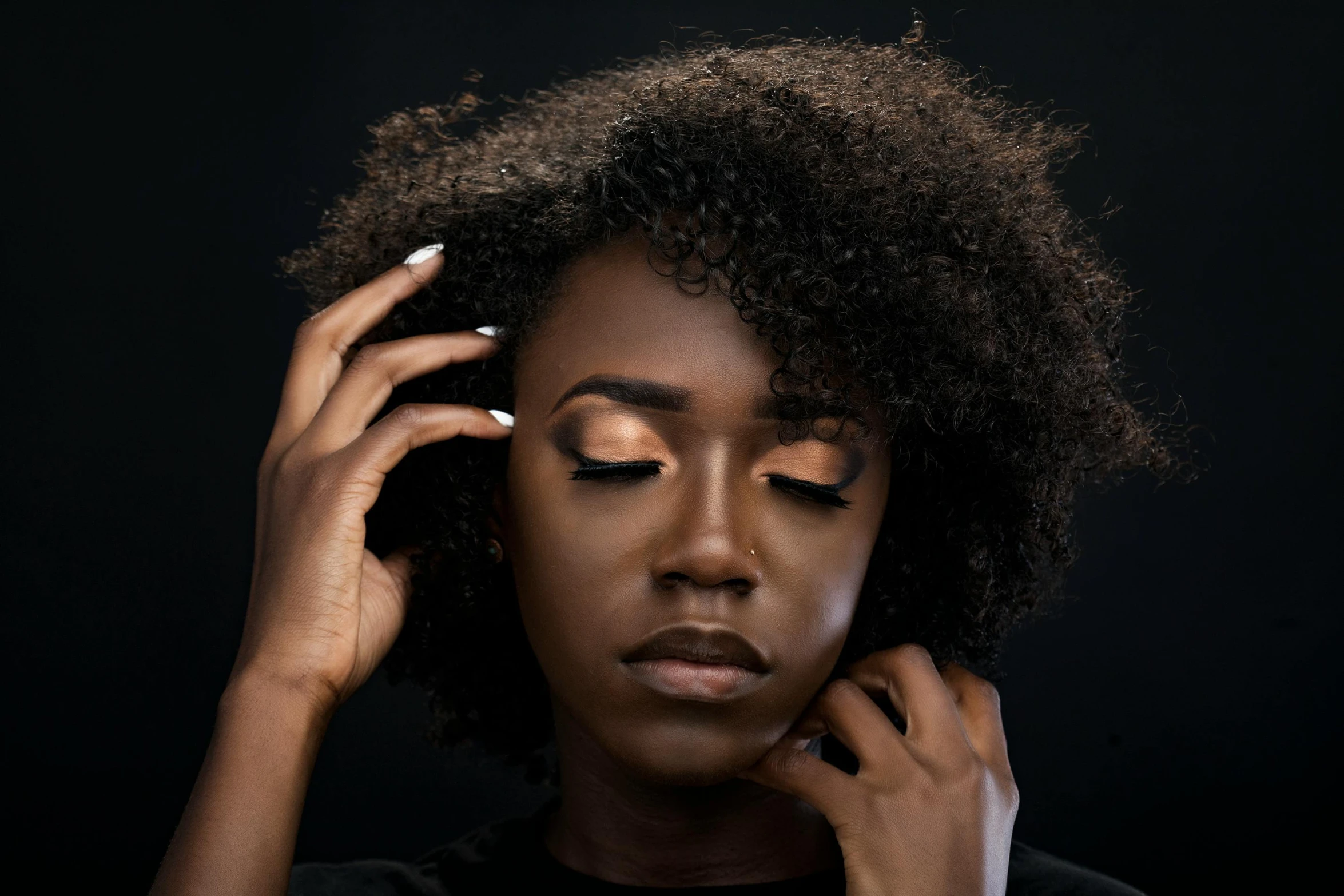 a close up of a person holding a cell phone to their ear, an album cover, inspired by Theo Constanté, trending on pexels, photorealism, brown skin. light makeup, makeup. unreal engine, black eyeshadow, with afro