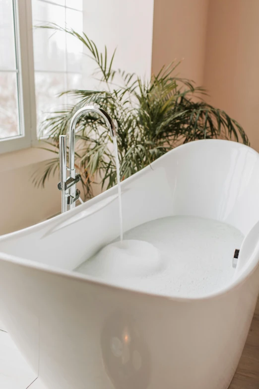 a white bath tub sitting in a bathroom next to a window, trending on unsplash, process art, made of liquid, botanical, soft volume absorbation, detailed product image