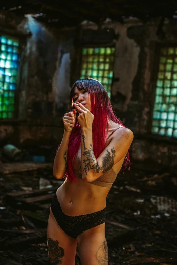 a woman with red hair smoking a cigarette, a tattoo, inspired by Elsa Bleda, pexels contest winner, graffiti, sexy pudica pose gesture, in a desolate abandoned house, asian woman, long pink hair