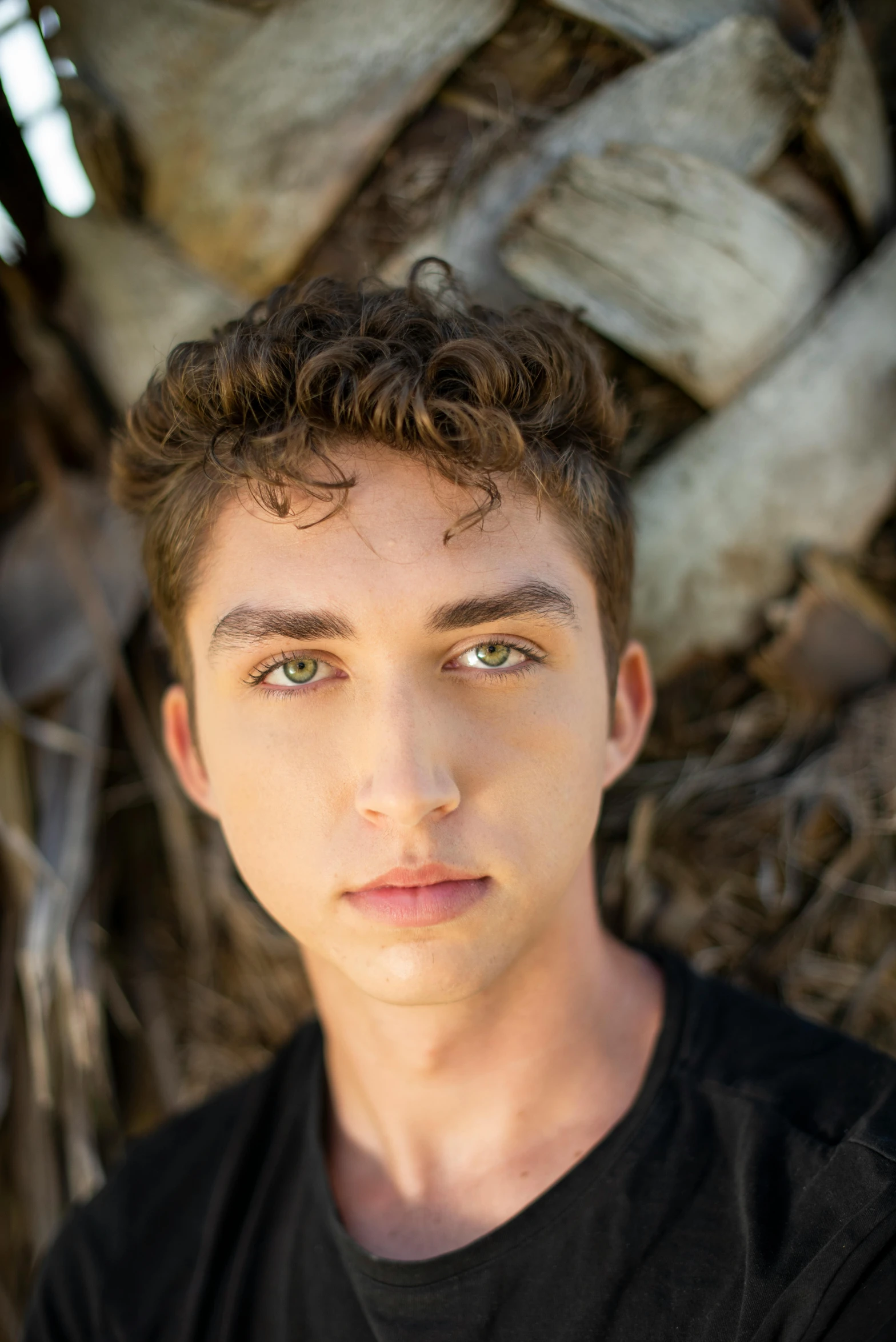 a young man standing in front of a palm tree, an album cover, inspired by John Luke, pexels contest winner, renaissance, acting headshot, beautiful huge eyes, ari aster, closeup headshot