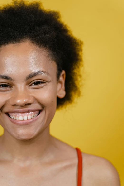 a close up of a person with a cell phone, a character portrait, by Carey Morris, pexels contest winner, yellow backdrop, smiling :: attractive, natural hair, smooth healthy skin