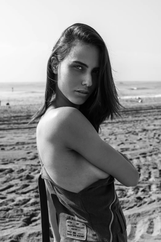 a black and white photo of a woman on the beach, inspired by Max Dupain, tumblr, photorealism, gal gadot as hell lord, ana de armas portrait, handsome girl, medium format