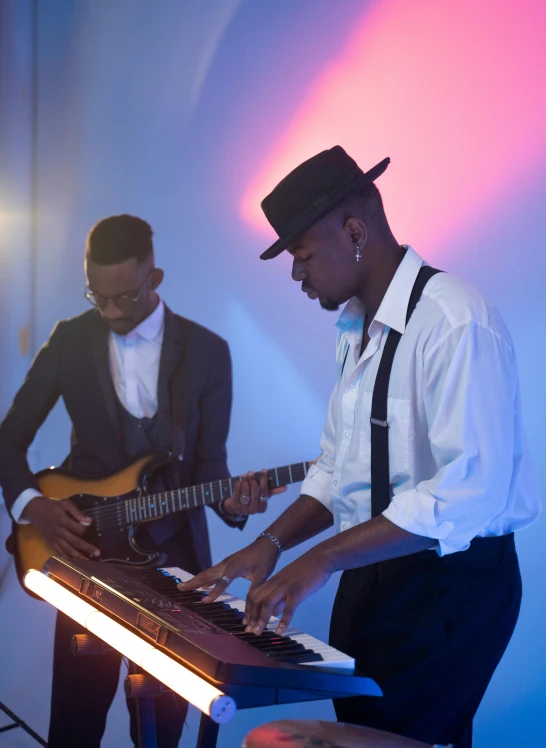 a group of men standing next to each other playing musical instruments, inspired by Michael Ray Charles, pexels, happening, ( ( dark skin ) ), profile image, soft glow, keyboardist