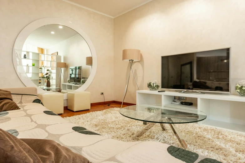 a living room filled with furniture and a flat screen tv, by Alexander Fedosav, pexels contest winner, art nouveau, round mirror on the wall, light beige pillows, neo kyiv, hd quality