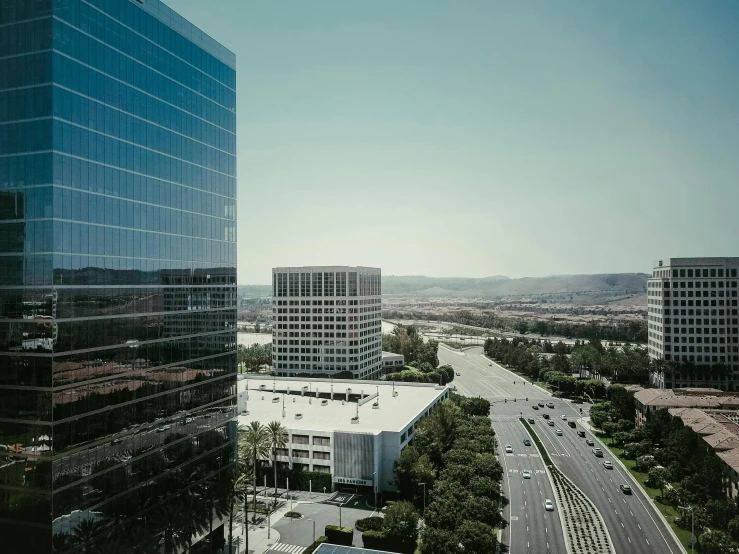 a view of a city from a high rise building, unsplash, renaissance, 1600 south azusa avenue, hyperrealism photo, office building, taken with sony alpha 9