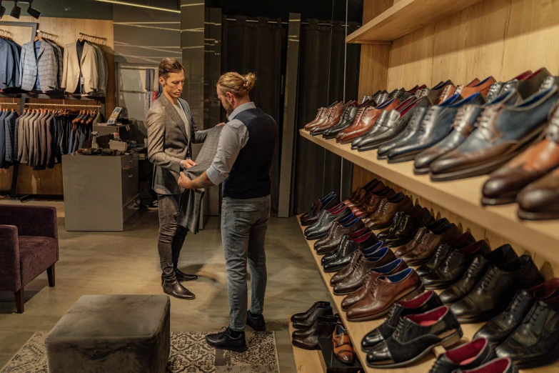 a couple of men standing next to each other in a room, by Jan Tengnagel, pexels, whole shoe is in picture, people shopping, luxury materials, australian