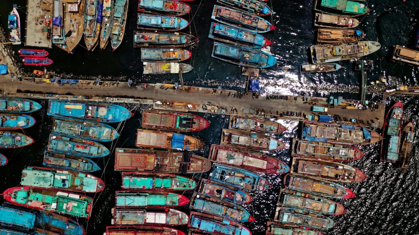 a group of boats sitting on top of a body of water, by Dan Christensen, pexels contest winner, hurufiyya, yann arthus - bertrand, shipping docks, thumbnail, various colors