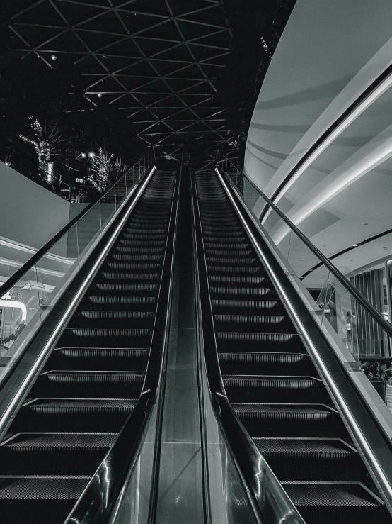 a black and white photo of an escalator, instagram post, ilustration, 4 k cinematic photo, monochrome:-2