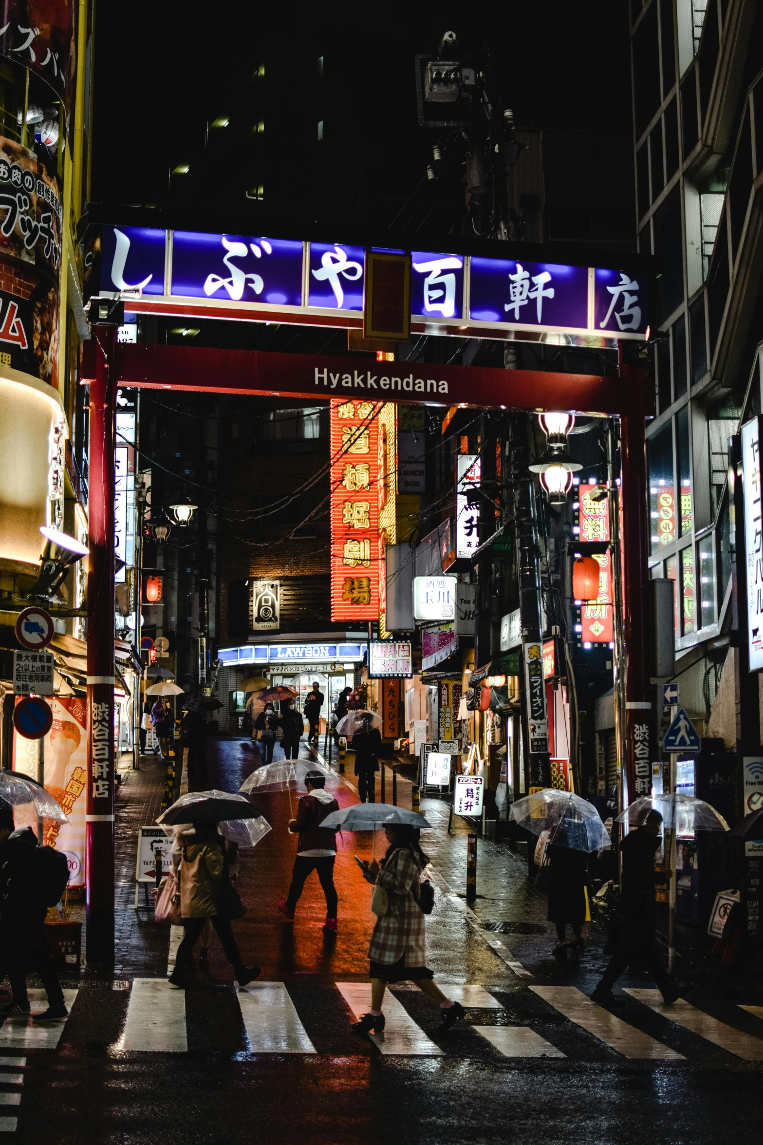 a group of people walking down a street at night, inspired by Shunkōsai Hokushū, pexels, wet market street, square, colorful signs, ethnicity : japanese