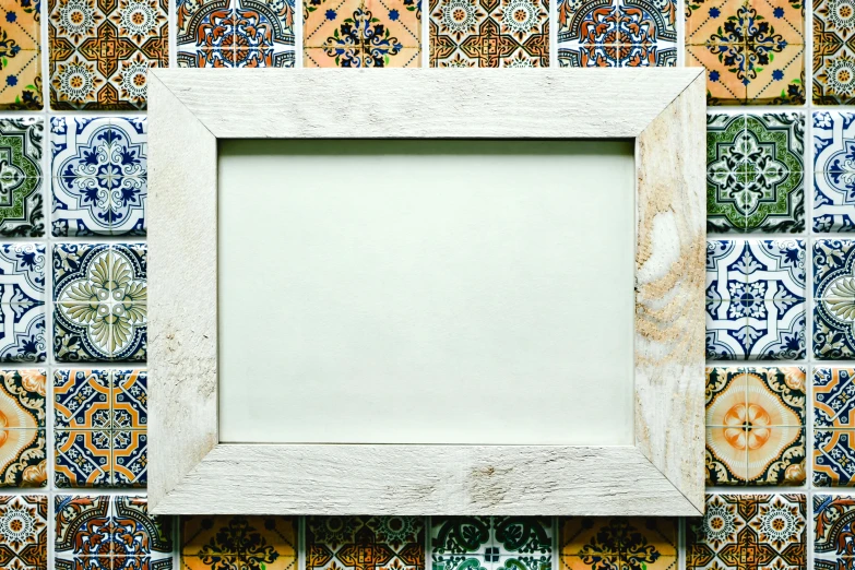 a picture frame sitting on top of a tiled wall, by Lucia Peka, pixabay, arts and crafts movement, white wood, moroccan, square, whiteboard