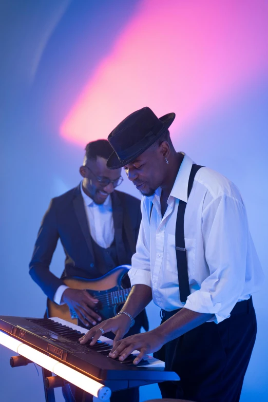 a couple of men standing next to each other playing a musical instrument, inspired by Richard Wright, event photography, ( ( dark skin ) ), lights on, smooth in the background