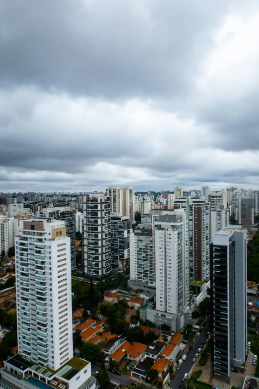 a view of a city from a high rise building, by Joze Ciuha, cloudy overcast sky, brazilian, 8k resolution”, 4k image