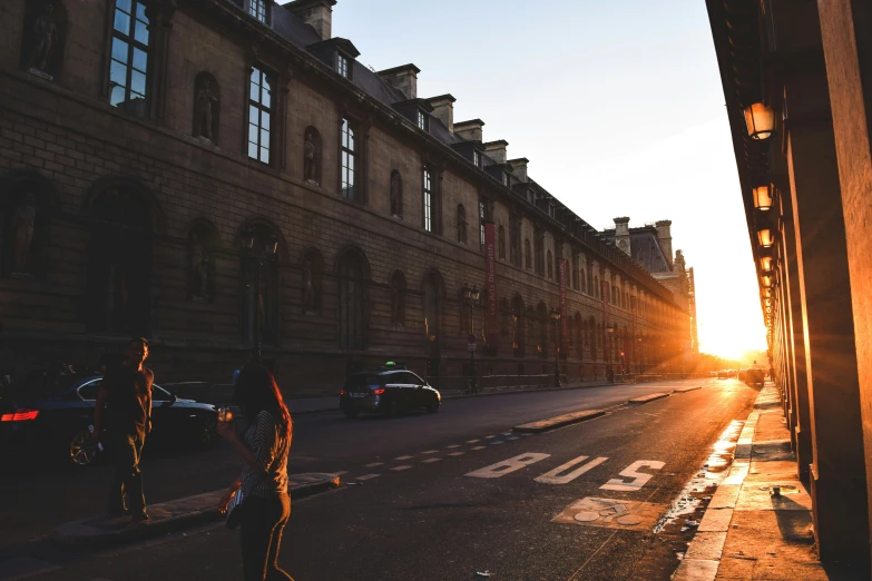 a person riding a skateboard on a city street, a photo, pexels contest winner, paris school, sun rising, french architecture, 1 2 9 7, fan favorite