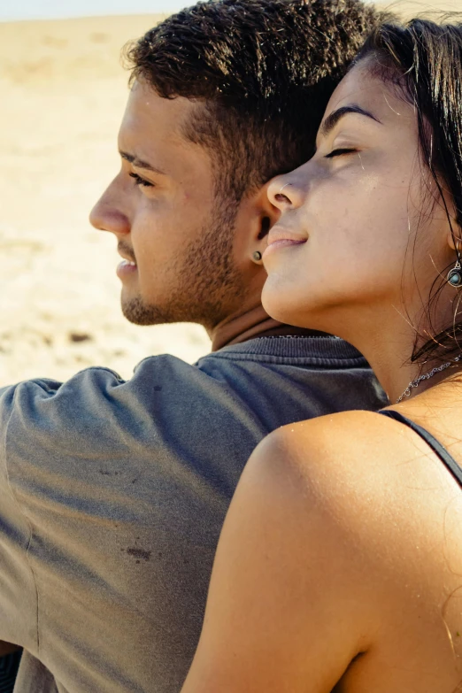 a man and a woman sitting next to each other on a beach, trending on pexels, renaissance, close up half body shot, brown, romantic lead, hispanic