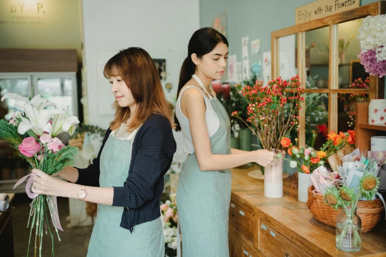 two women standing next to each other in a flower shop, trending on pexels, animation, maintenance, fan favorite, ivy's