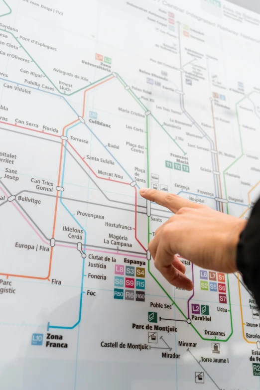 a close up of a person pointing at a map, poster art, interactive art, trams, madrid, whiteboard, engineered