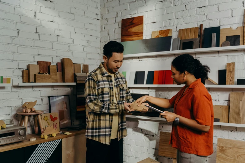 a couple of people that are standing in a room, on a wooden desk, product display, holding a clipboard, inspect in inventory image