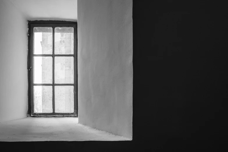 a black and white photo of a window in a building, by Jan Kupecký, unsplash contest winner, minimalism, chiaroscuro painting, studio medium format photograph, peaceful mood, in an attic